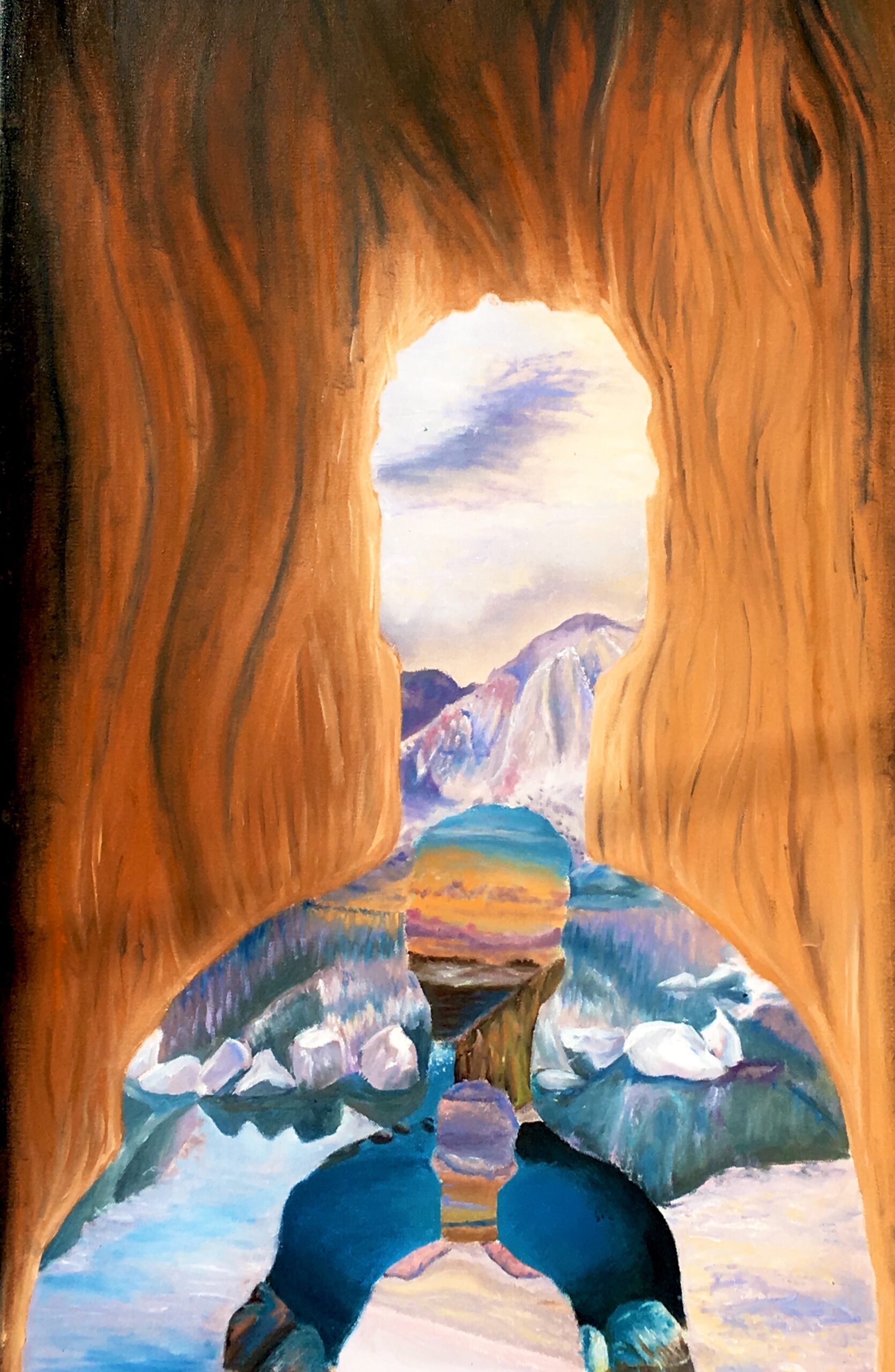 A wooden silhouette of a person with several other silhouettes within each other depicting mountain scenes within them.